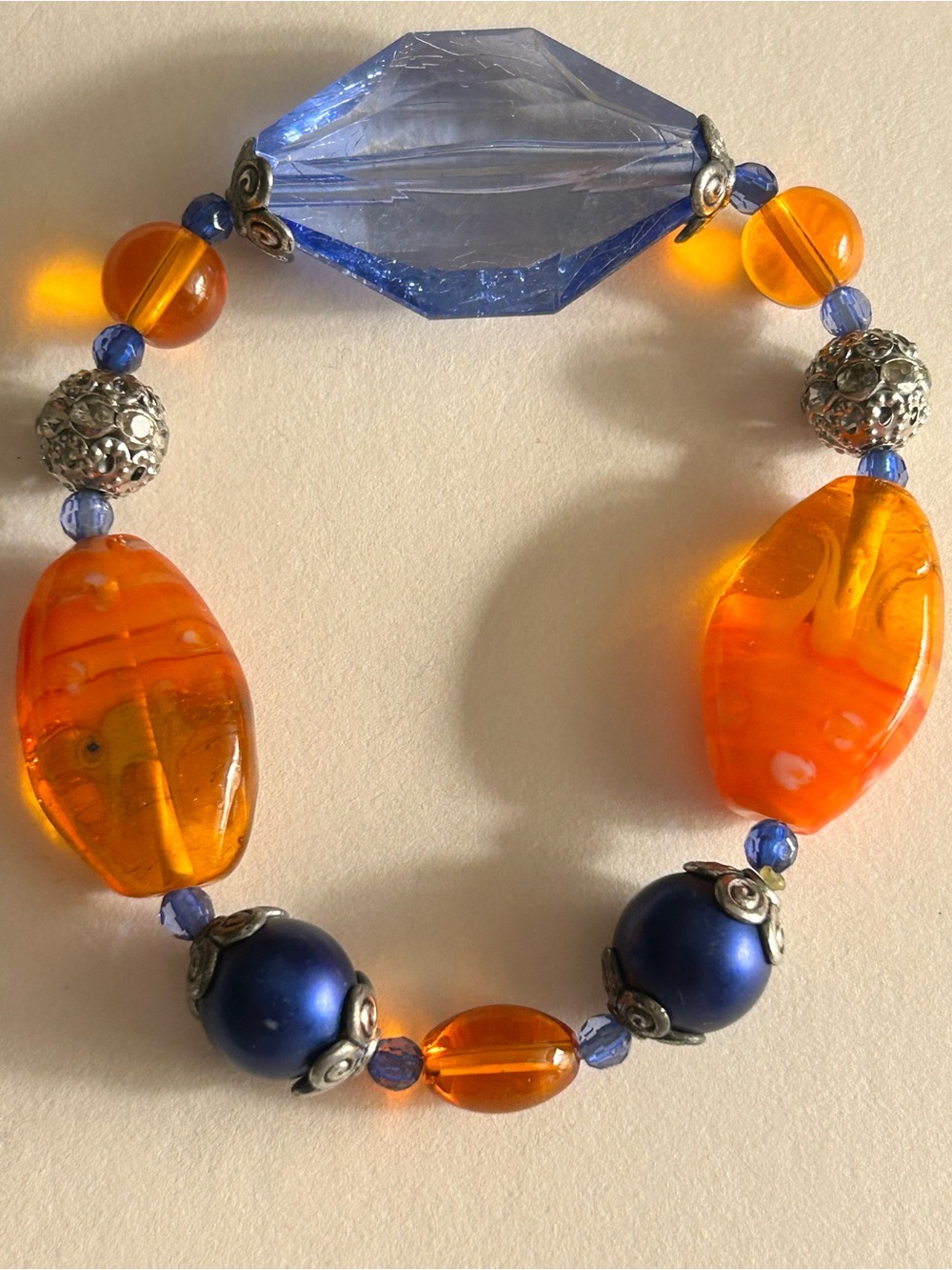 Bracelet Orange Art glass, matte cobalt blue faux pearls, filigree beads stretch